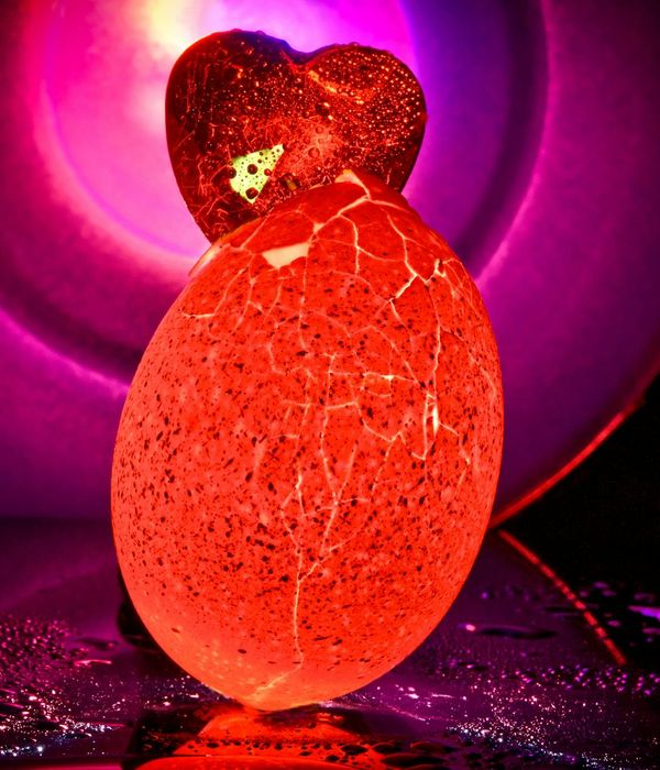 Abstract glowing geometric shapes in deep violet space